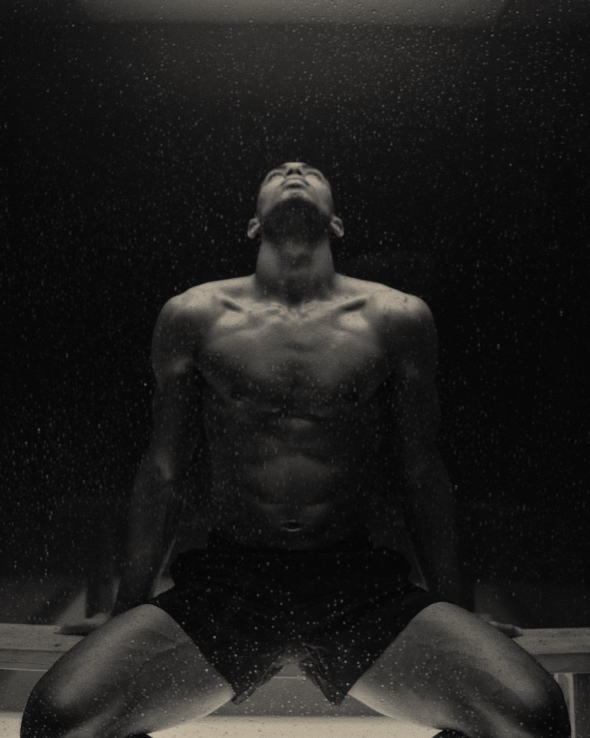 Jude Bellingham on a locker-room bench, head tilted back after training