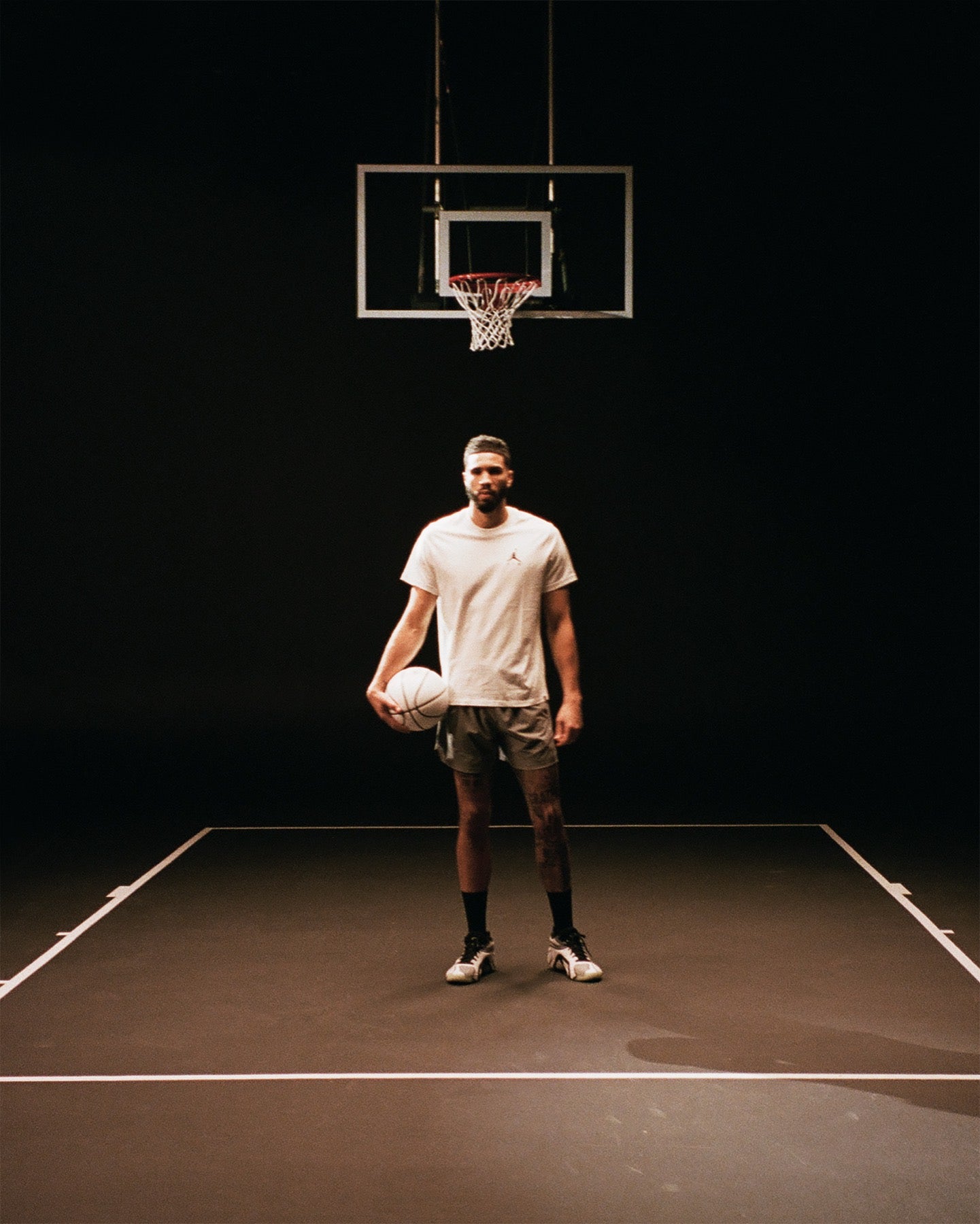 Jayson Tatum on court with a basketball
