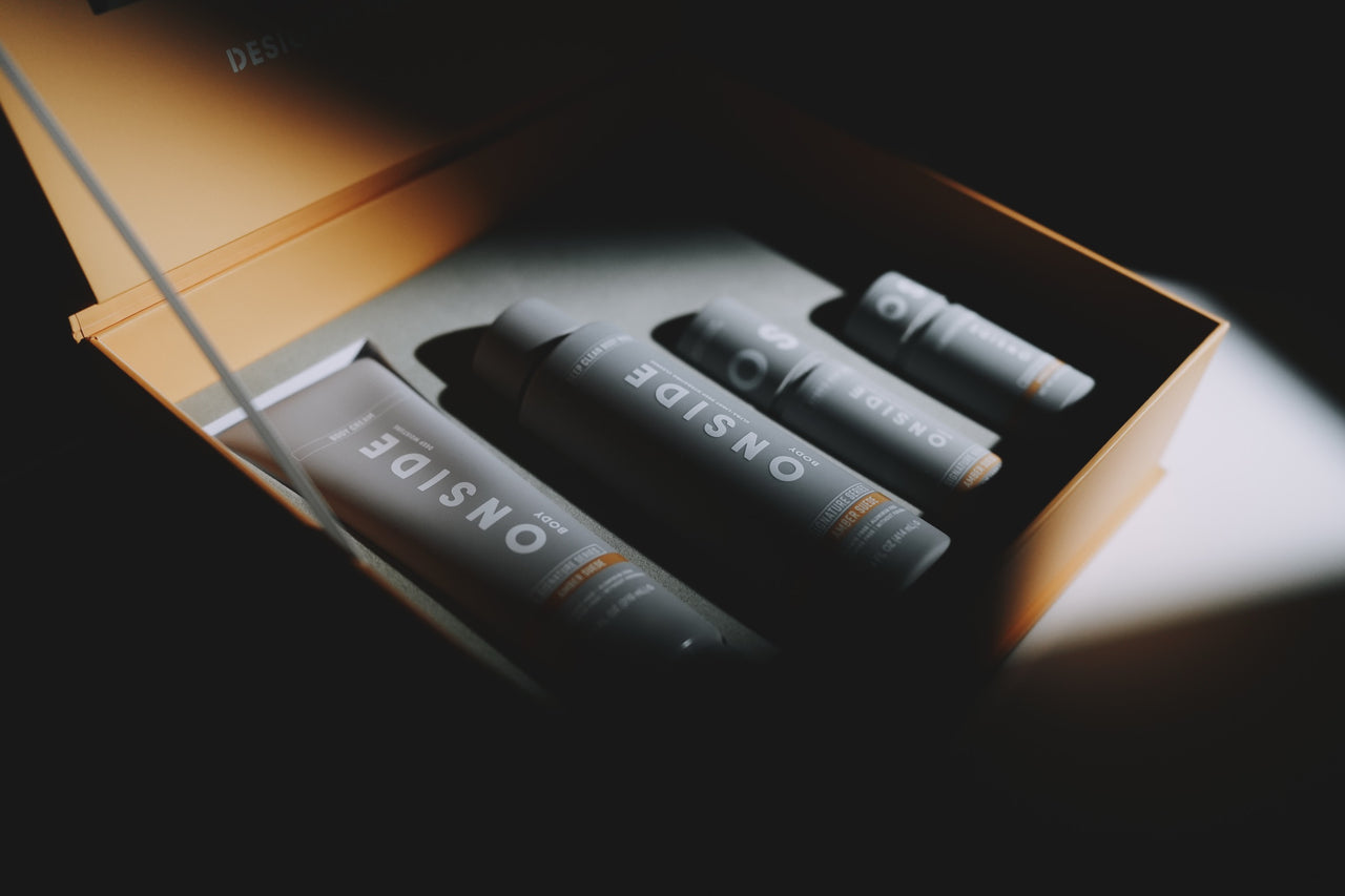 The Amber Suede Signature Series box, open, with four products inside