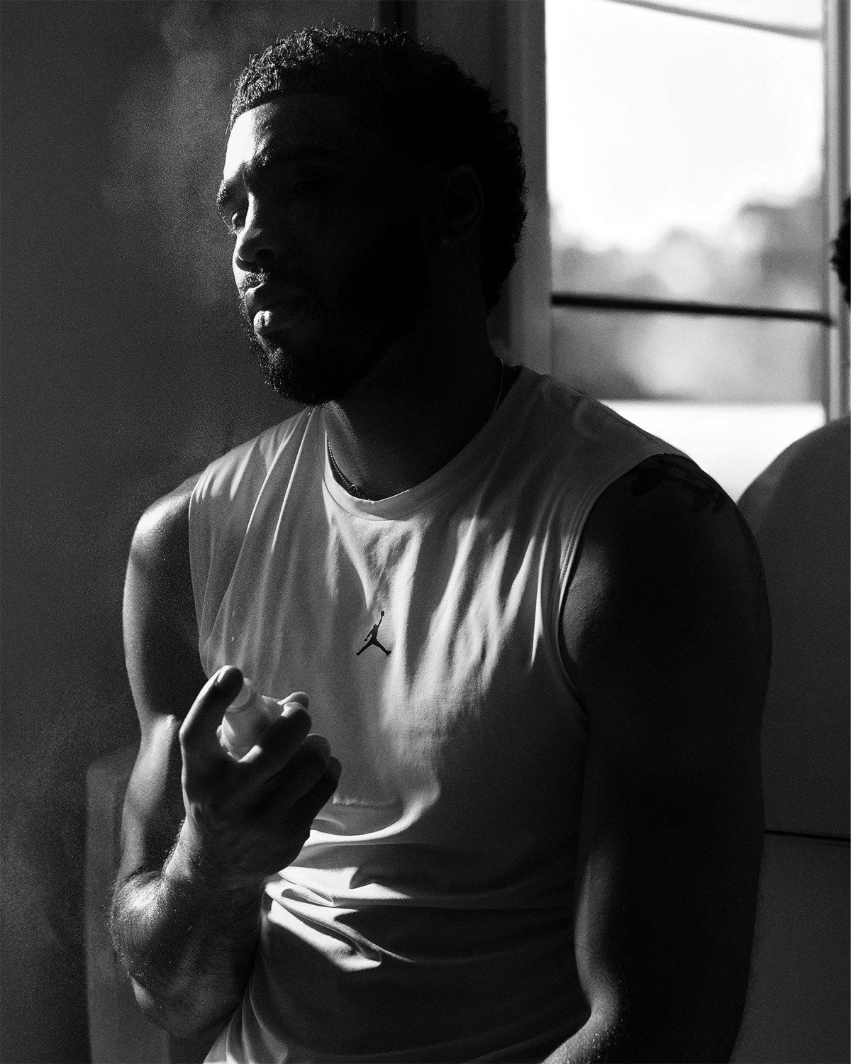 Jayson Tatum by a window, black and white